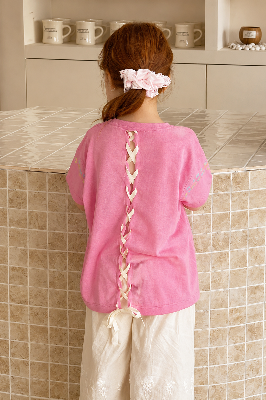 Pink Silk-Feel Tee with Ethnic Embroidery & Lace-Up Back