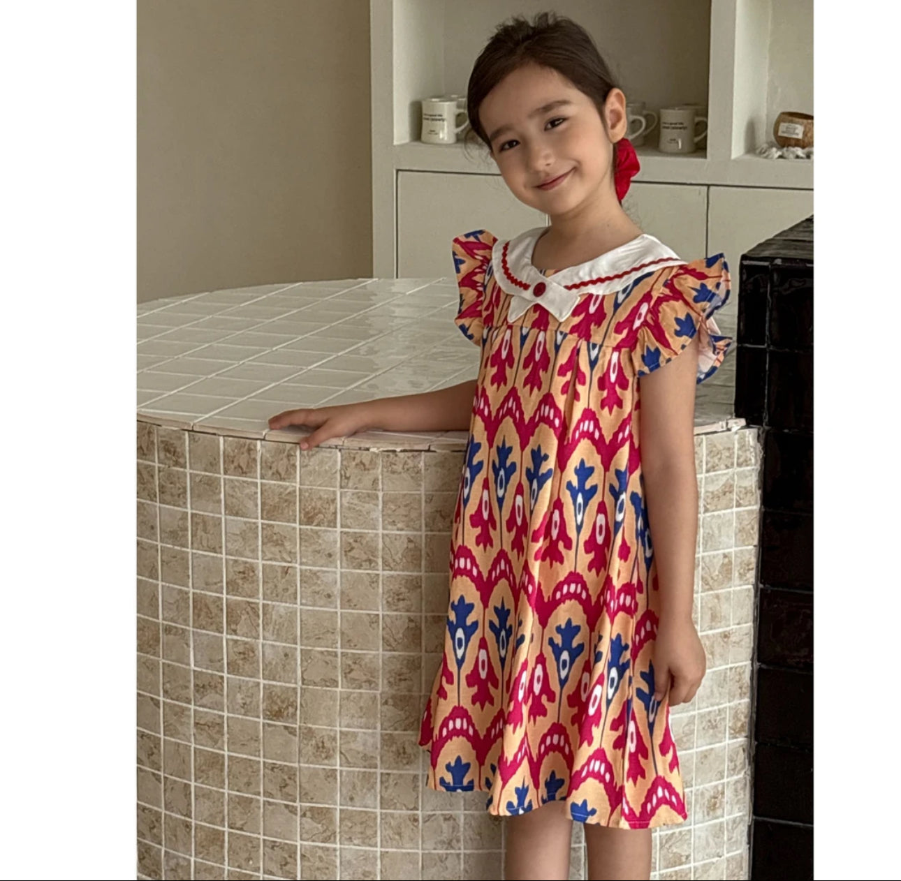 “Peach Bloom” Atlas Ikat Dress – Ruffle Sleeve & Peter Pan Collar | Fade-Resistant & Cool