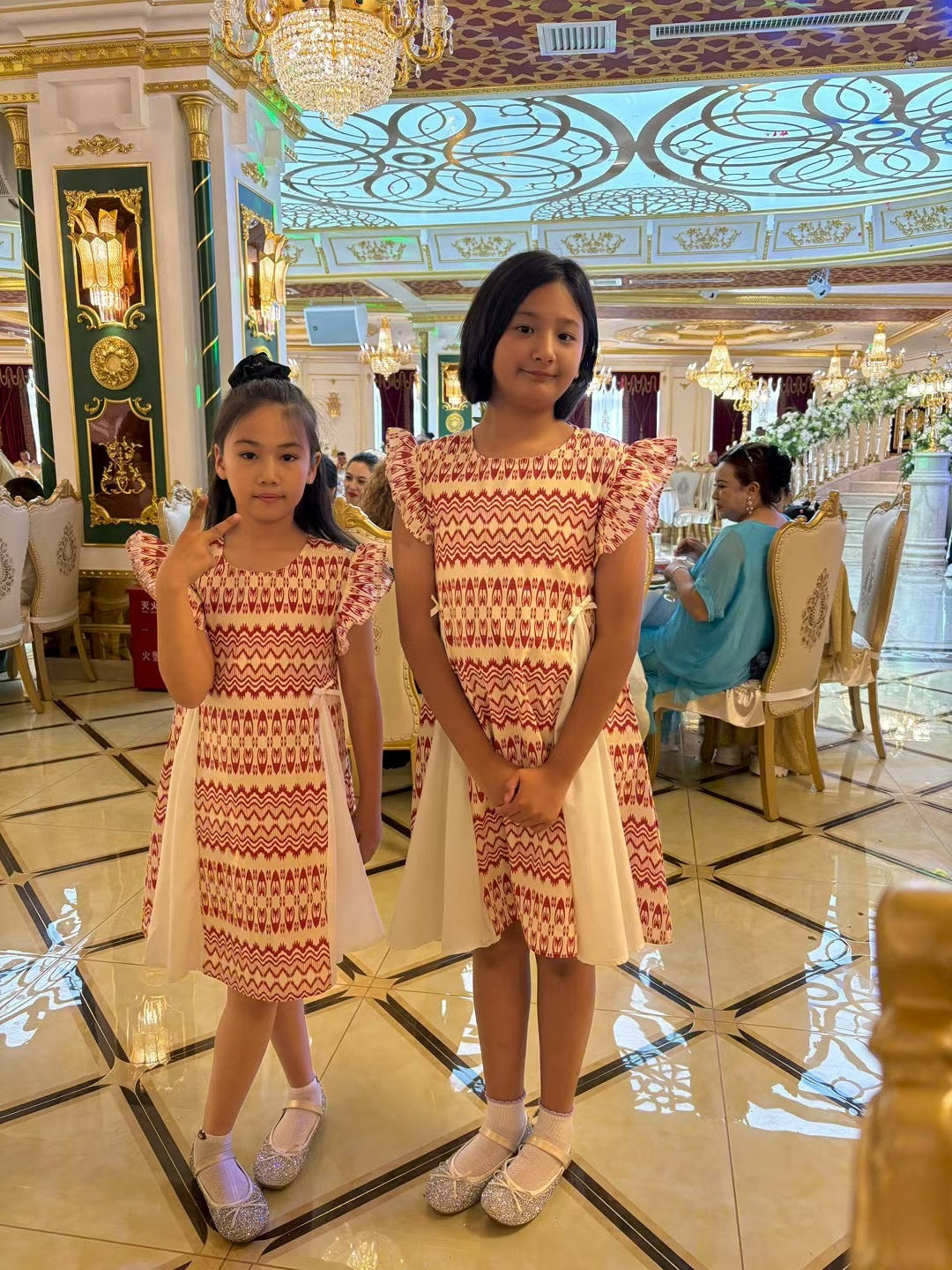 Child wearing colorful Liwanay kidswear in a real family moment