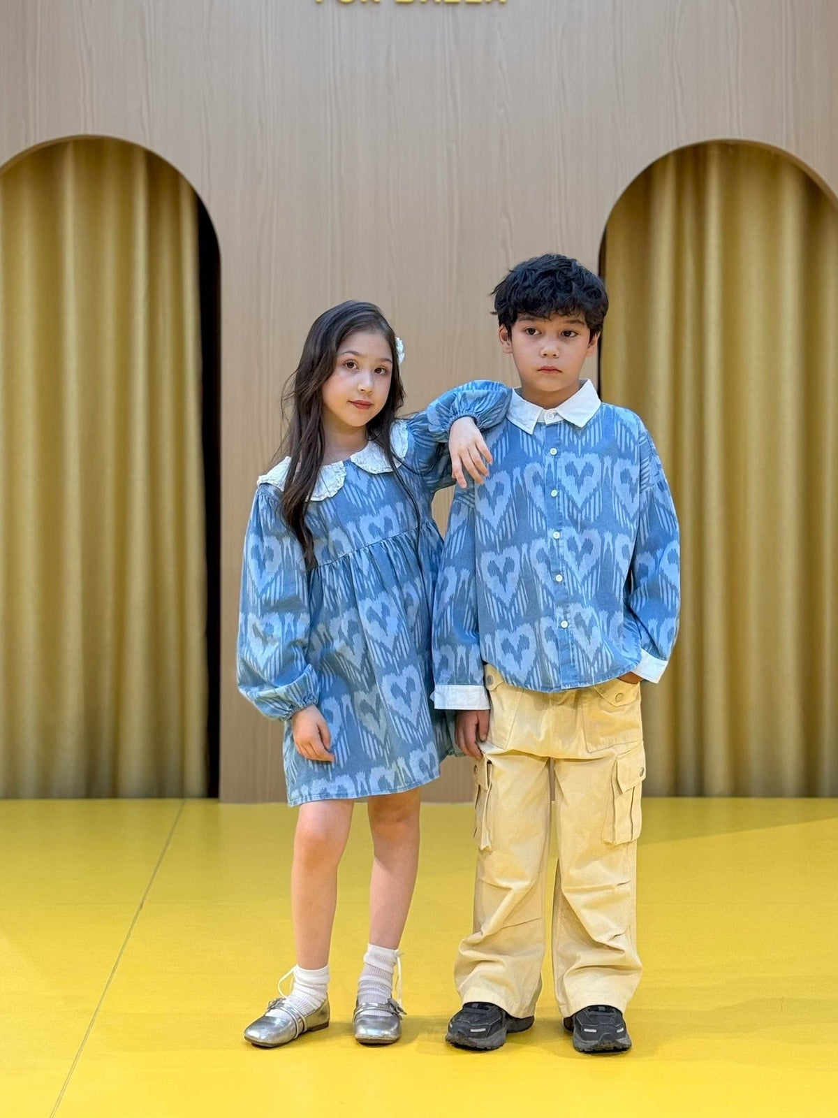 Child wearing colorful Liwanay kidswear in a real family moment