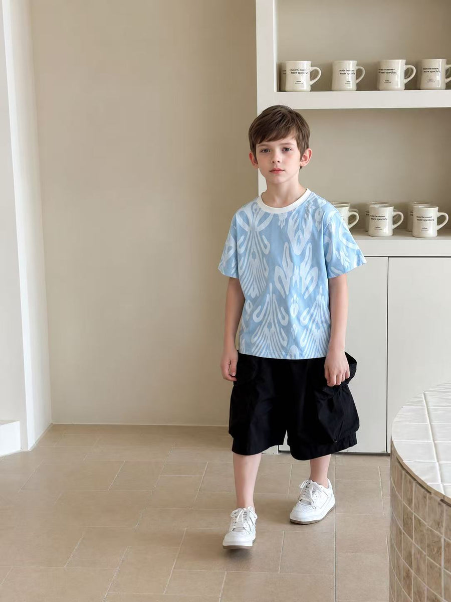 Child wearing soft everyday Liwanay kidswear in a warm home setting